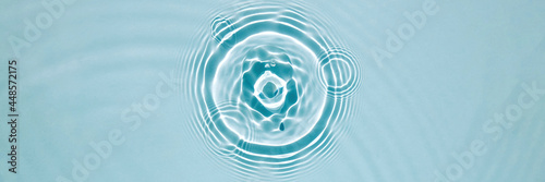 Blue water texture, blue mint water surface with rings and ripples. Spa concept background. Flat lay, copy space.