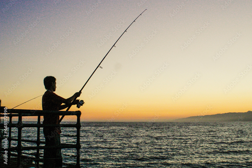 Fishing at Sunset at Santa Monica Pier Pacific Park Fishing at Sunset at Santa Monica Pier Pacific Park