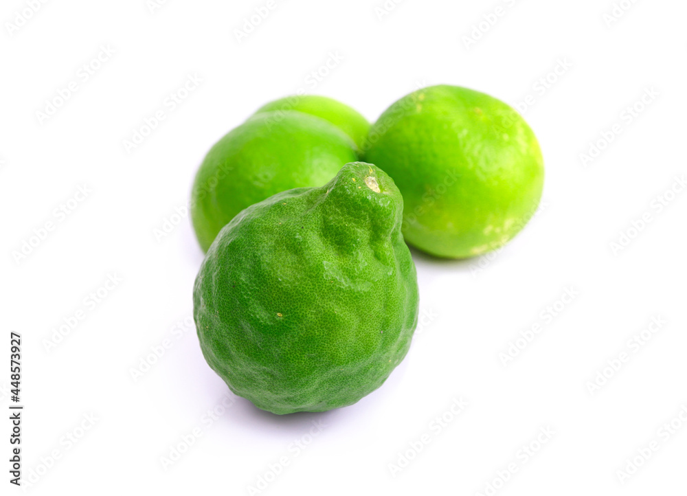 fresh green lemon and bergamot on white background fresh green lemon and bergamot on white background