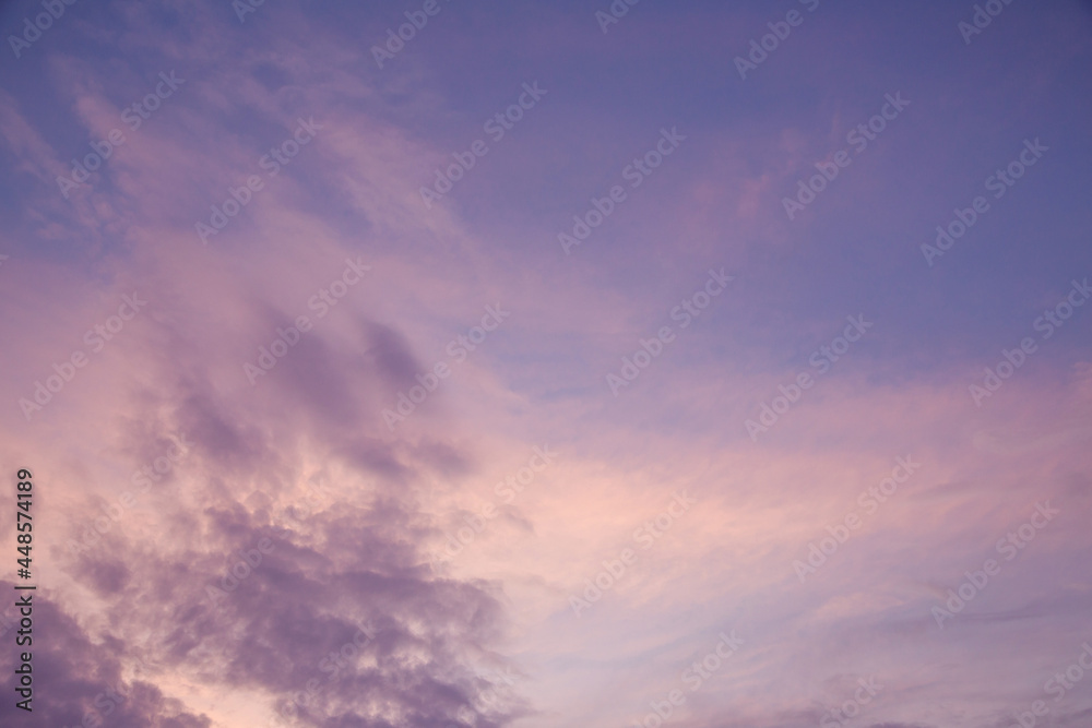 evening sky with clouds and rays of the sun, background