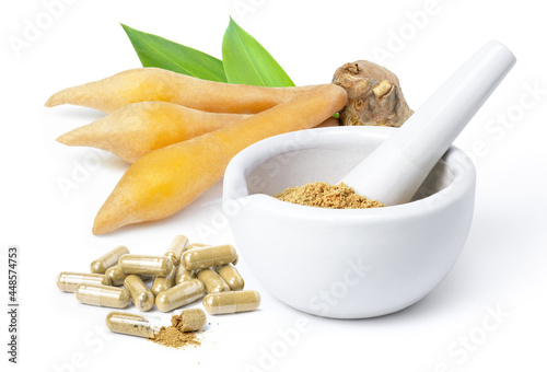 Fingerroot with finger root powder nerbal capsules isolated on white  photo