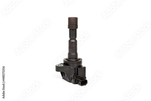 Old Ignition coil of Gasoline engine white background service concept and maintenance long time with car