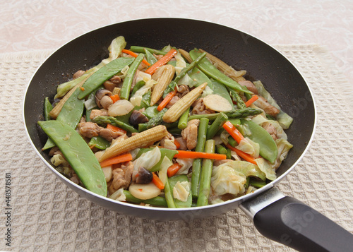 Chinese vegetable and chicken stir fry in wok