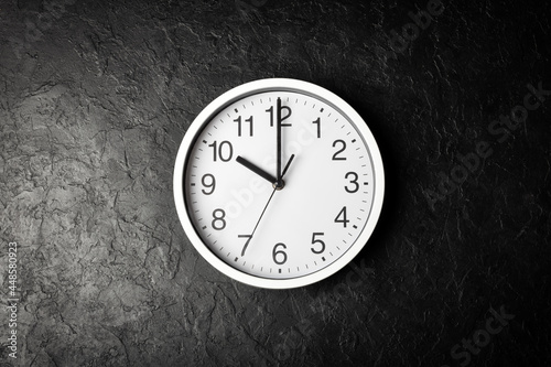 Clock on the black texture background
