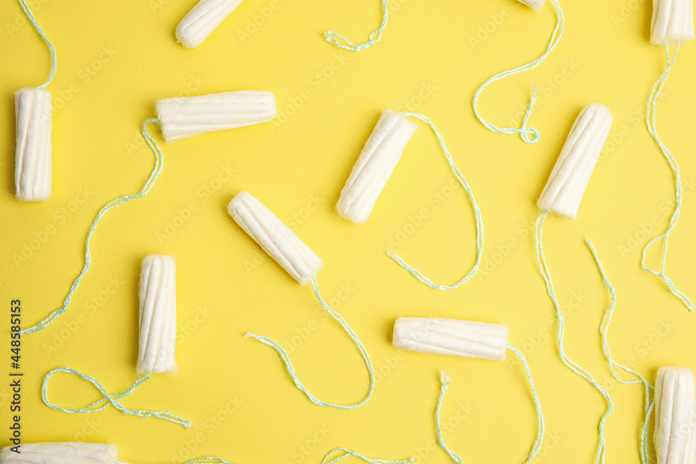 Tampons on yellow background, flat lay. Menstrual hygiene product Tampons on yellow background, flat lay. Menstrual hygiene product