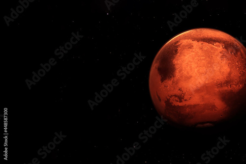 Planet Mars on a dark background. Elements of this image were furnished by NASA. © Artsiom P