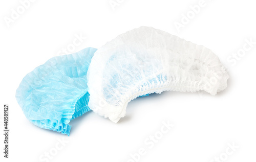 Blue and white medical non woven  disposable caps isolated on white background with clipping path