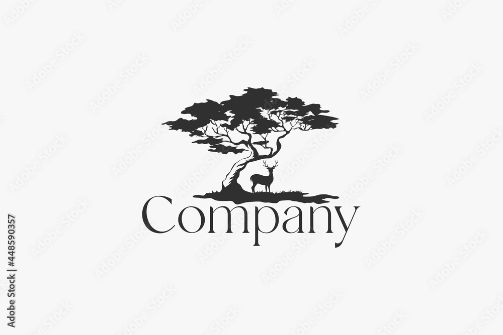 Elegant tree logo with a deer underneath for any business.