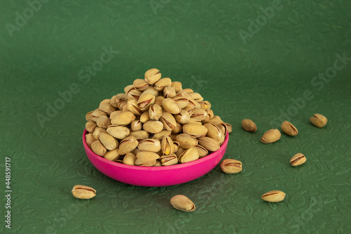 Pistachio Plate Pile isolated green background