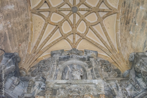 Decorations on the ceiling of an old church in northern Spain, Navarra. Contains images of saints and geometric shapes.