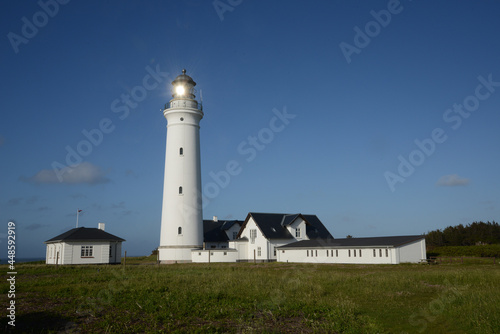 Old building and lighthouse of Hirtshals Fyret, Denmark photo