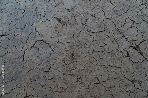 Cracked dry clay wall texture