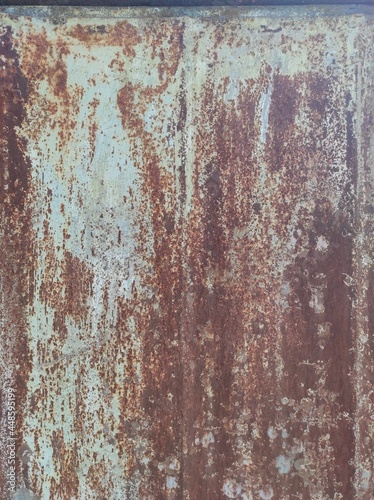 Texture of old painted rusty metal with faded peeling paint.