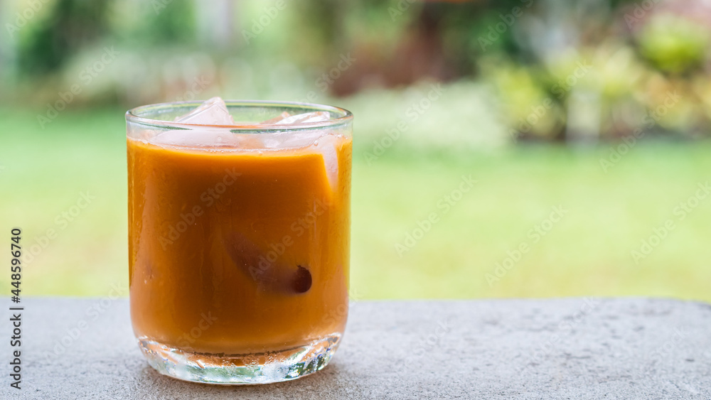 ice tea or ice thai tea in glass , fresh dessert with nature background ice tea or ice thai tea in glass , fresh dessert with nature background