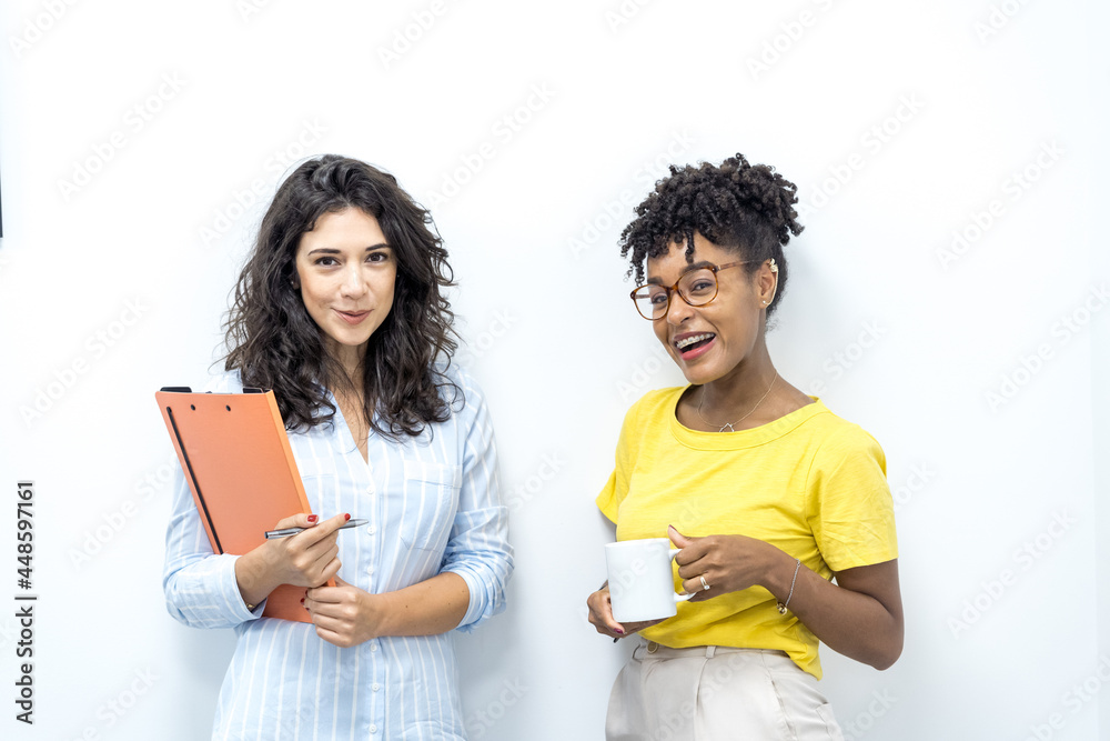 mixed race coworkers working at the office looking at mobile phone mixed race coworkers working at the office looking at mobile phone