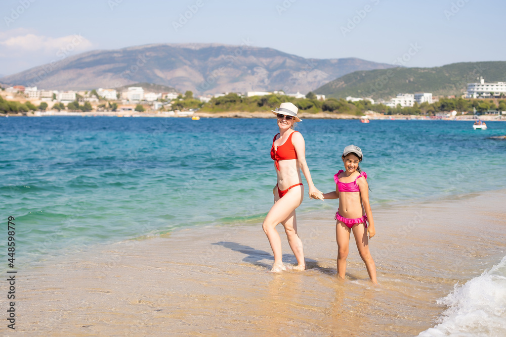 Mother with little daughter on the beach Mother with little daughter on the beach