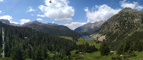 Landscape in the National Park of Aigüestortes and Lake San Mauricio. View of the Lake Llong and the valley. Pyrenees Mountains. Catalonia. Spain. photo