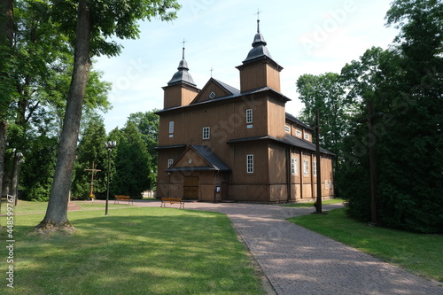 Narew, Poland - July 12, 2021: Orthodox brown church. Parish of the Assumption of the Blessed Virgin Mary and St. Stanislaus the Bishop and Martyr. Summer sunny day