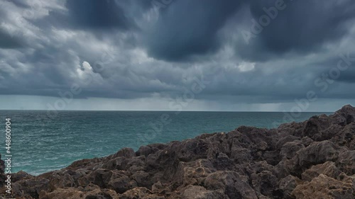 Detailed view of volcanic coastline with high cliffs and waves breaking over volcanic rocks, Portugal.