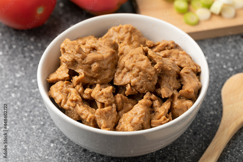Bowl with raw Asian Seitan, wheat gluten, close up Bowl with raw Asian Seitan, wheat gluten, close up