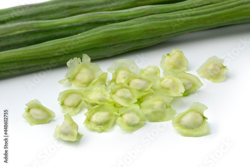  Fresh raw green whole moringa beans and seed isolated on white background