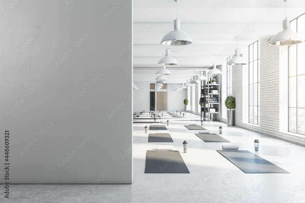 Modern bright white yoga studio gym interior with empty brick wall, window  and city view. Mock up, 3D Rendering. Stock Photo