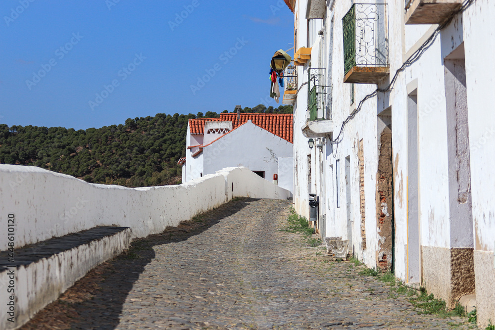 Typical narrow street in the ancient town of Mertola, Alentejo Region, Portugal.