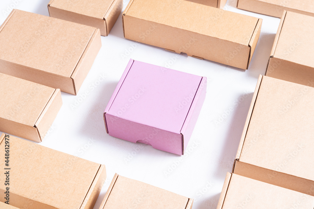 Lot of flat brown and pink cardboard boxes