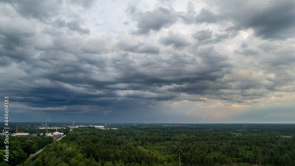 Aerial photo taken with a drone of a dark ominous grey storm clouds. Dramatic sky. lighting in dark stormy clouds. High quality photo