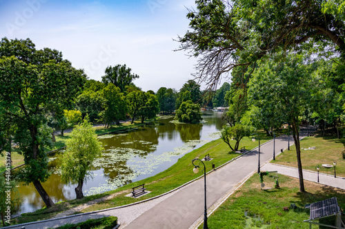 Photography Beautiful sunny summer day in a green park in Craiova, Romania