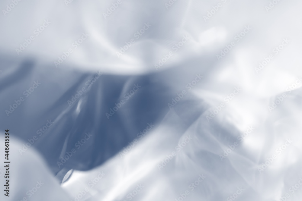 Fototapeta premium Blue and white Abstract background. Soft and smooth blurred background. Defocused tulle fabric photography