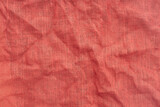 Red Burlap Fabric with Wrinkles background texture. Full Frame