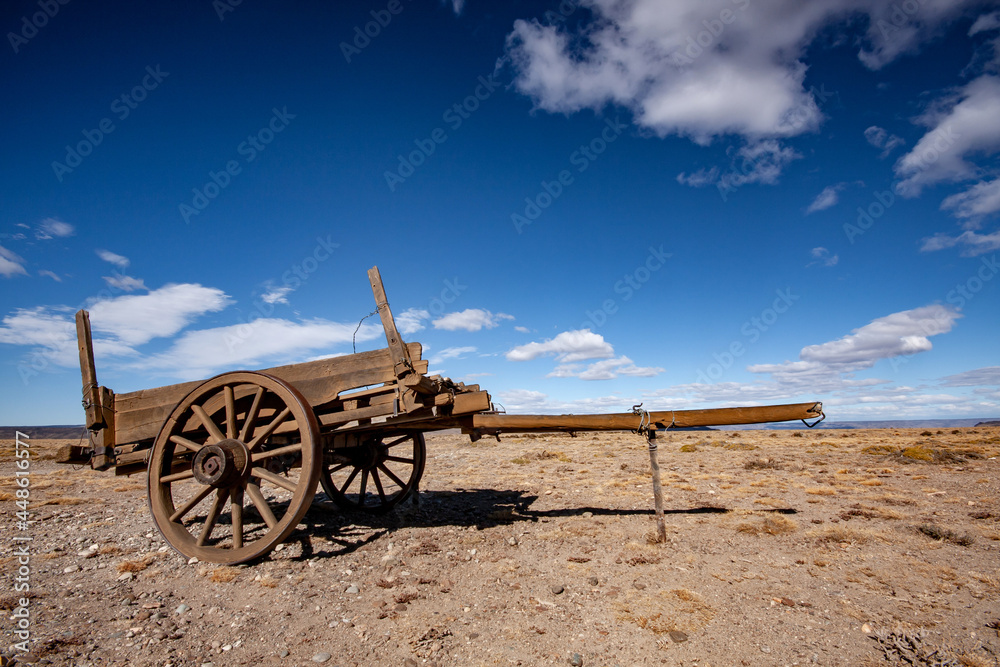 old abandoned farm wooden cart wagon in the desert