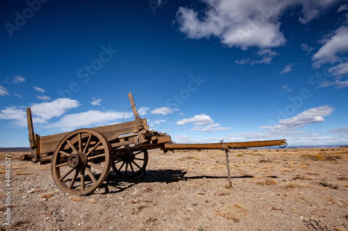 old abandoned farm wooden cart wagon in the desert