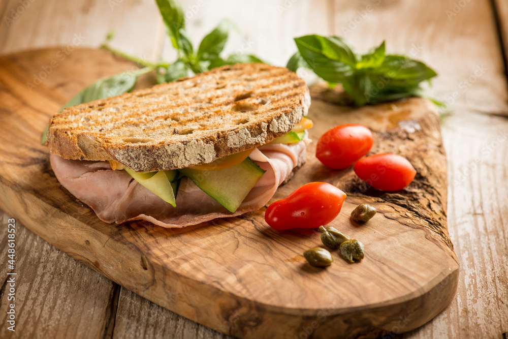 sandwich with ham scamorza cheese sliced zucchinis tomato and capers sandwich with ham scamorza cheese sliced zucchinis tomato and capers