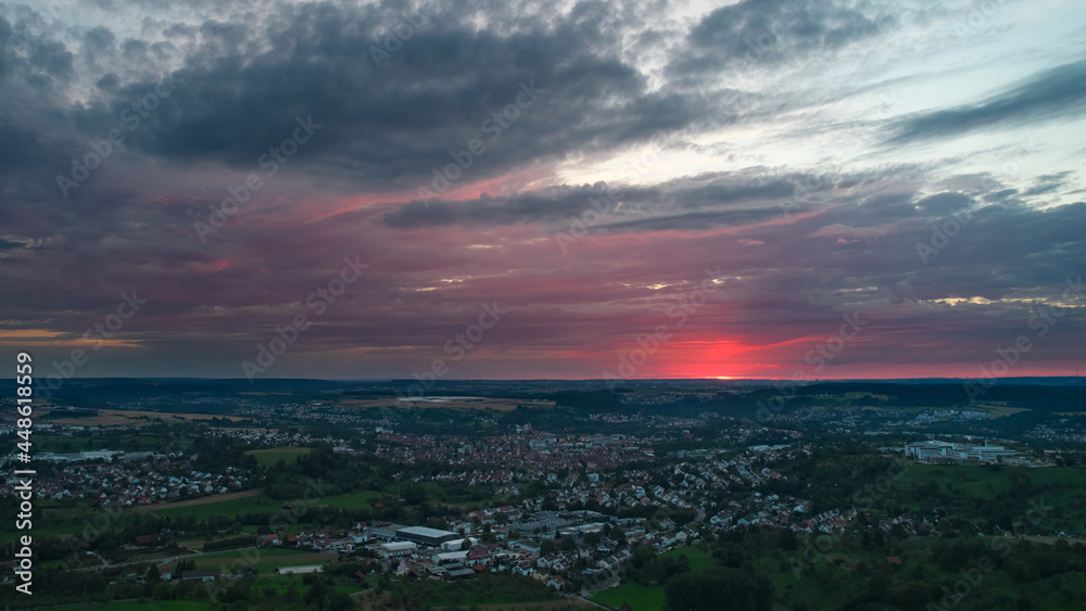 Aerial view of a german city near stuttgart. Sunset with beautiful cloudy sky. Germany, Nurtingen.