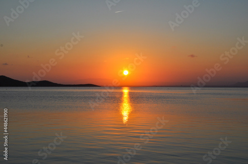 Sunset over the water Mar Menor in La Manga, Murcia with view for Isla del Barón