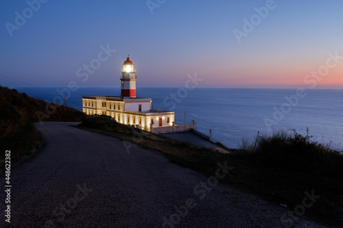 Cabo Silleiro lighthouse on the Atlantic coast of Galicia at sunset photo