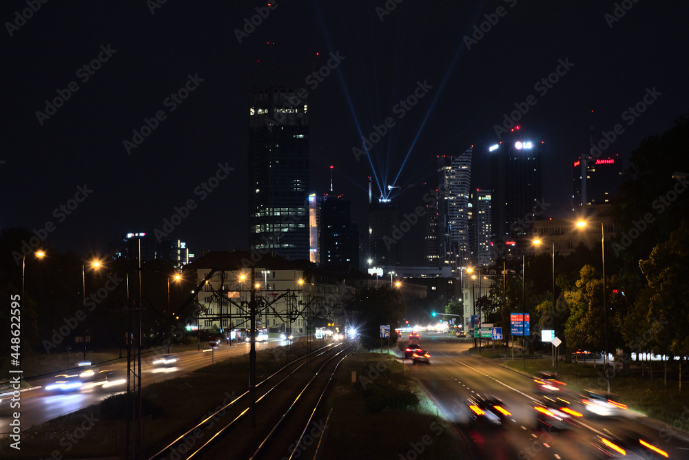 view of the center of warsaw at night, light show, completion of the construction of the skysawa skyscraper view of the center of warsaw at night, light show, completion of the construction of the skysawa skyscraper