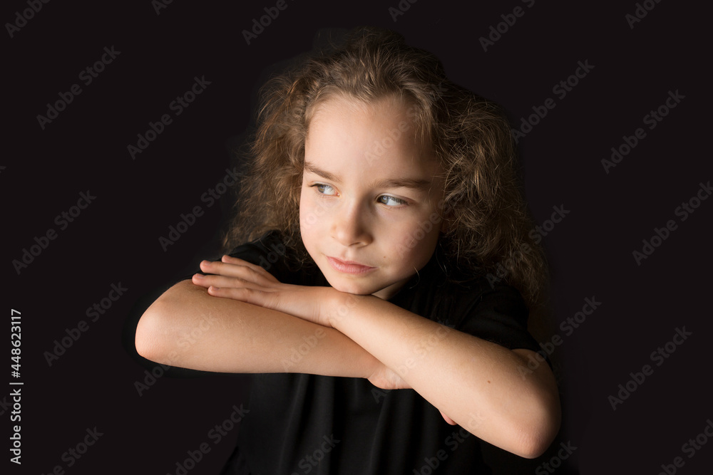 Emotions of a teenage girl. Black clothes. Black studio background. Emotions of a teenage girl. Black clothes. Black studio background.