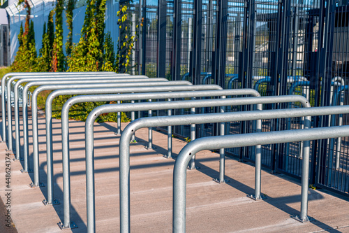 Metal railings in front of gates of Silesian Stadium in Chorzów, Poland. Row of steel rails. Entrance to the sport arena.