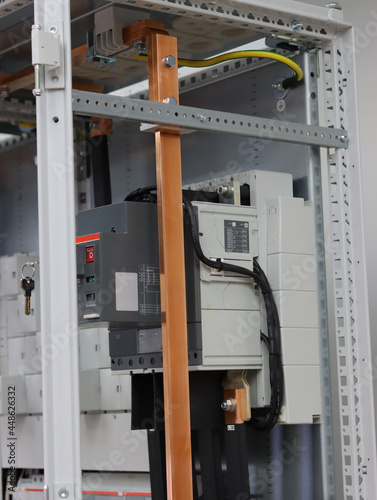 Connection of electrical protection switches using insulated copper wires in the electrical panel.