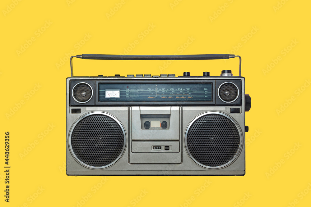 RADIO CASSETTE PLAYER ON YELLOW BACKGROUND. URBAN MUSIC FASHION FROM THE  EIGHTIES. foto de Stock | Adobe Stock