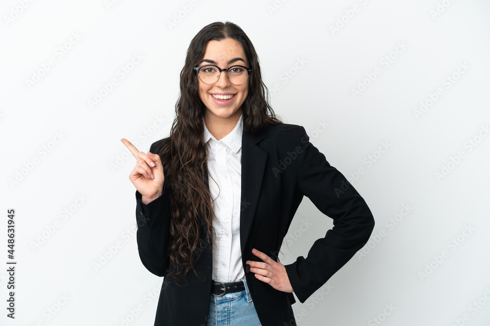 Young business woman isolated on white background pointing to the side to present a product