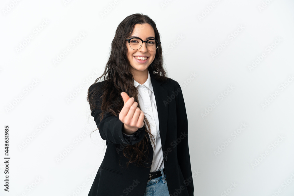 Young business woman isolated on white background making money gesture Young business woman isolated on white background making money gesture