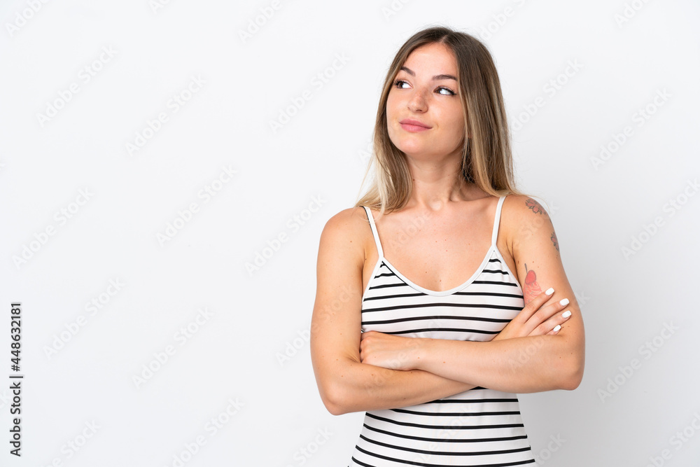 Young Romanian woman isolated on white background looking to the side Young Romanian woman isolated on white background looking to the side