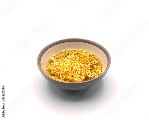 Instant noodles in bowl isolated on white background