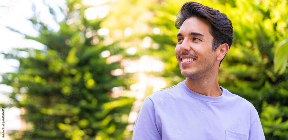 Young caucasian man at outdoors with happy expression Young caucasian man at outdoors with happy expression