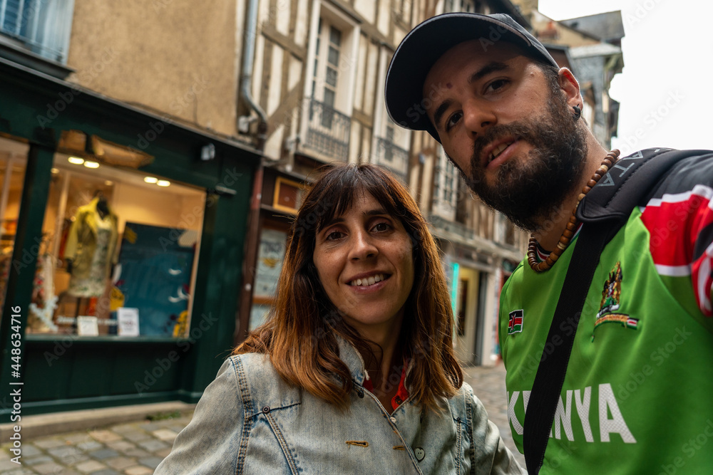 A couple in the medieval half-timbered houses in Rennes. Capital of the province of Brittany, France