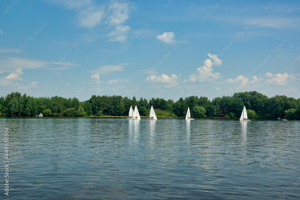 Moscow, Russia - July 15, 2021: Sailboats on the river, Klyazminskoye reservoir near Moscow